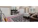 Bonus room with a work-from-home office setup, plush rug, and natural light at 11406 Conifer Ridge Dr, Conifer, CO 80433