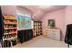 Walk-in closet with shelving, hanging racks, neutral walls, and bright natural light at 11406 Conifer Ridge Dr, Conifer, CO 80433