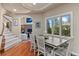 Dining room with beautiful wood floors and natural light from windows at 11406 Conifer Ridge Dr, Conifer, CO 80433