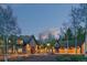 Stunning stone home with lush landscaping and mature trees, perfect for luxury living at 11406 Conifer Ridge Dr, Conifer, CO 80433