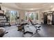 Home gym with weightlifting equipment, treadmill, and exercise machines at 11406 Conifer Ridge Dr, Conifer, CO 80433
