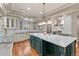 Spacious kitchen with custom cabinets, marble counters and stainless appliances at 11406 Conifer Ridge Dr, Conifer, CO 80433