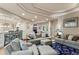 Open-concept living room with hardwood floors, neutral tones, and adjoined kitchen and dining area at 11406 Conifer Ridge Dr, Conifer, CO 80433