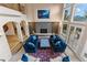 Open floor plan with fireplace and large windows overlooking a natural wooded area at 11406 Conifer Ridge Dr, Conifer, CO 80433