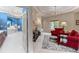 Elegant main bedroom suite with sitting area, chandelier, and view to bath at 11406 Conifer Ridge Dr, Conifer, CO 80433