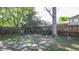 This backyard features a wood fence, stone paver patio, and metal pergola at 13833 W 68Th Ave, Arvada, CO 80004