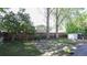 This backyard features a wood fence and a stone paver patio at 13833 W 68Th Ave, Arvada, CO 80004
