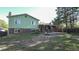 Spacious backyard features a covered patio, offering a relaxing outdoor living space with ample greenery at 13833 W 68Th Ave, Arvada, CO 80004