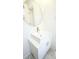Modern bathroom with vanity, white counter and gold faucet and accents at 13833 W 68Th Ave, Arvada, CO 80004