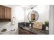Stylish bathroom with a modern sink, decorative accents, and a built-in cabinet at 13833 W 68Th Ave, Arvada, CO 80004