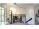 Bright hallway with modern railing, skylight, and an open view of living space, offering a unique architectural detail at 13833 W 68Th Ave, Arvada, CO 80004