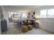 Bright living room featuring a comfortable sofa, stylish decor, and ample natural light at 13833 W 68Th Ave, Arvada, CO 80004