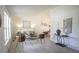 Bright living room boasts neutral walls, modern decor, and wood-look floors for a welcoming atmosphere at 13833 W 68Th Ave, Arvada, CO 80004