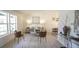 Bright living room featuring modern decor, white walls, and light wood floors, creating an open and inviting atmosphere at 13833 W 68Th Ave, Arvada, CO 80004