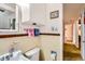 Well-lit bathroom with storage, offering a blend of convenience and classic charm at 7948 Stuart St, Westminster, CO 80030