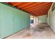 Covered carport with storage cabinets, leading to an outdoor parking area, plus extra space for parking cars at 7948 Stuart St, Westminster, CO 80030
