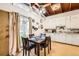 Bright eat-in kitchen featuring modern ceiling fan, vaulted ceilings, and a cozy dining space at 7948 Stuart St, Westminster, CO 80030