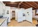 Spacious kitchen showcasing lots of cabinet space, hardwood floors, and connecting rooms at 7948 Stuart St, Westminster, CO 80030
