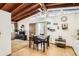 Open-concept living and dining area with vaulted ceilings, hardwood floors, and natural light at 7948 Stuart St, Westminster, CO 80030