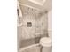 Modern bathroom with a glass-enclosed shower featuring stylish tile and modern fixtures at 381 S Ames St # F208, Lakewood, CO 80226