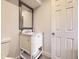 Clean bathroom features a vanity with storage and a framed mirror for grooming and storage at 381 S Ames St # F208, Lakewood, CO 80226