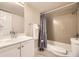 Well-lit bathroom featuring a shower-tub, vanity with sink and toilet at 381 S Ames St # F208, Lakewood, CO 80226