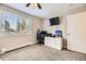 Bedroom with soft carpeting, window view, and an equipped desk area at 381 S Ames St # F208, Lakewood, CO 80226