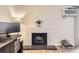 Stylish fireplace with tile surround provides a focal point in the living space at 381 S Ames St # F208, Lakewood, CO 80226