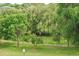 Scenic view of lush green space surrounded by trees at 381 S Ames St # F208, Lakewood, CO 80226