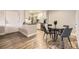 Modern kitchen and dining area with stainless steel appliances and sleek, updated countertops at 381 S Ames St # F208, Lakewood, CO 80226