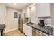 Updated kitchen with stainless steel appliances, granite countertops, and ample cabinet space at 381 S Ames St # F208, Lakewood, CO 80226