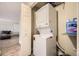 Efficient laundry area with stacked washer and dryer for space-saving convenience at 381 S Ames St # F208, Lakewood, CO 80226
