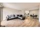 Open floor plan featuring a spacious living room that flows into the kitchen and dining area at 381 S Ames St # F208, Lakewood, CO 80226