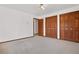 Bedroom with closet, neutral carpet and natural lighting at 6980 Oak St, Arvada, CO 80004