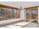 Cozy dining area with lots of natural light and sliding glass door access to deck at 6980 Oak St, Arvada, CO 80004