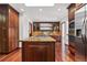 Kitchen featuring granite countertops, stainless steel appliances, and dark wood cabinets at 6980 Oak St, Arvada, CO 80004