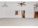 Open floor plan featuring a living area with high ceilings and a view into the kitchen at 6980 Oak St, Arvada, CO 80004