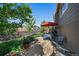 A cozy backyard with a patio, outdoor furniture, a fire pit, and a well-maintained lawn at 1758 Parkdale N Cir, Erie, CO 80516