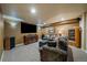 Basement living area features plush seating, media center, decor, and entertainment at 1758 Parkdale N Cir, Erie, CO 80516