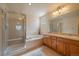 Bright bathroom features a glass shower, soaking tub, double sink vanity, and neutral tones at 1758 Parkdale N Cir, Erie, CO 80516
