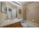 Cozy bathroom features a shower and tub combo and a single sink vanity at 1758 Parkdale N Cir, Erie, CO 80516