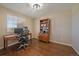 Office featuring wood floors, a desk near the window and a wood bookshelf at 1758 Parkdale N Cir, Erie, CO 80516