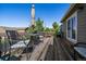 Relaxing outdoor deck featuring dining table, chairs and outdoor grill perfect for entertaining at 1758 Parkdale N Cir, Erie, CO 80516