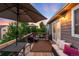 Spacious deck area with outdoor furniture and mature trees offering shade at 1758 Parkdale N Cir, Erie, CO 80516