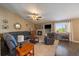Bright living room with fireplace, built-ins, vaulted ceiling, and plush seating at 1758 Parkdale N Cir, Erie, CO 80516