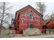 Brick building exterior with a stone wall and steps at 3233 Osage St # 2A, Denver, CO 80211