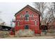 Red brick building with steps and a dark-colored door at 3233 Osage St # 2A, Denver, CO 80211