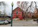 Brick building, possibly commercial, with dark door and streetlamp at 3233 Osage St # 2A, Denver, CO 80211