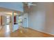 Open kitchen with white cabinets, granite counters, and exposed brick wall at 3233 Osage St # 2A, Denver, CO 80211