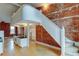 Living room with exposed brick, hardwood floors, and a loft area at 3233 Osage St # 2A, Denver, CO 80211